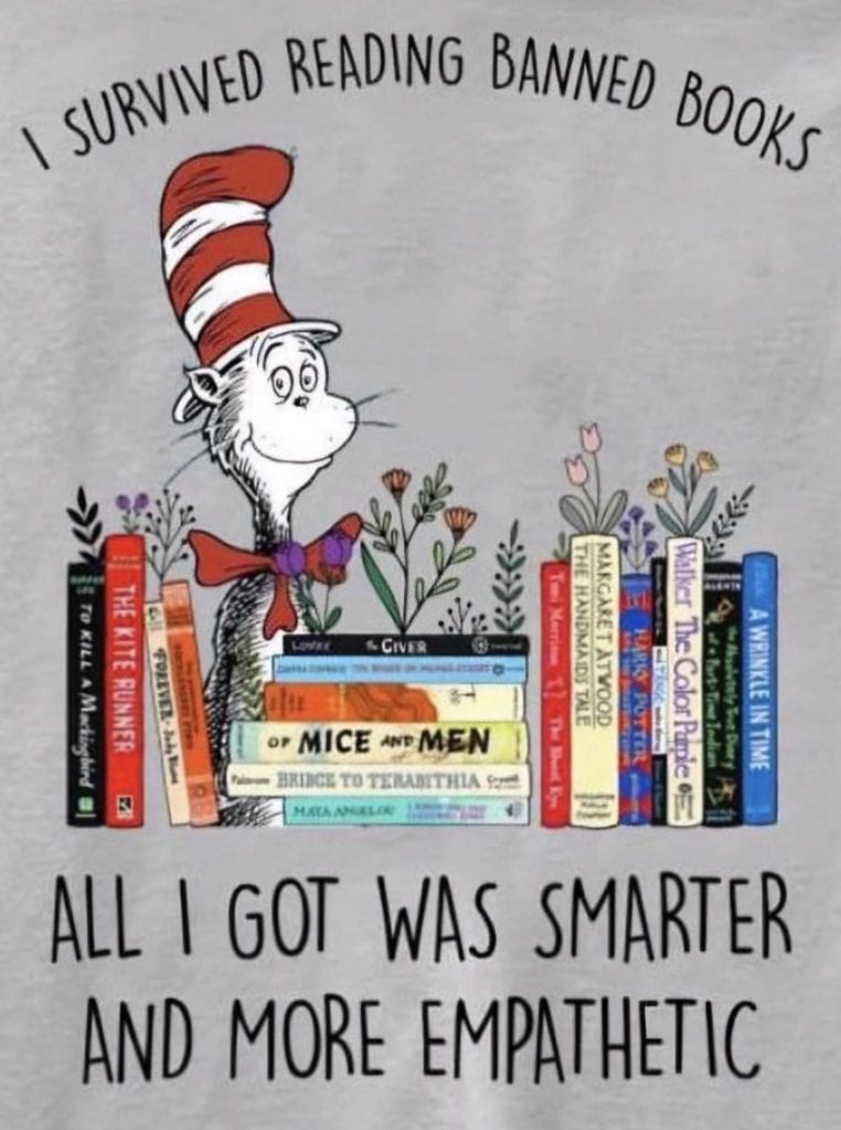 The Cat In The Hat surrounded by banned books, saying “I Survived Reading banned Books-All I Got Was Smarter And More Empathetic”